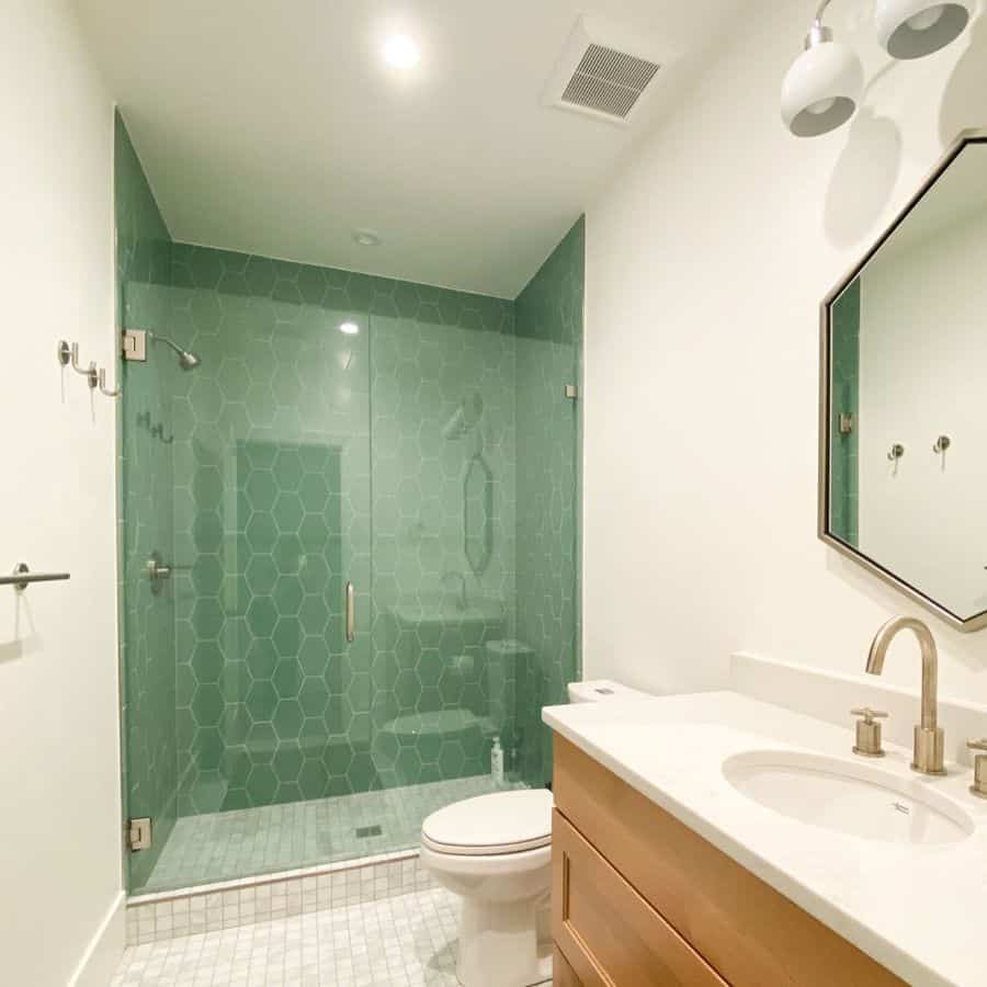 basement bathroom with green shower walls