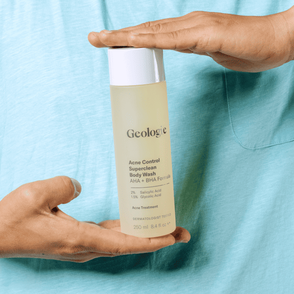 Geologie SuperClean Body Wash in hand. One of the 5 best tips for managing body acne